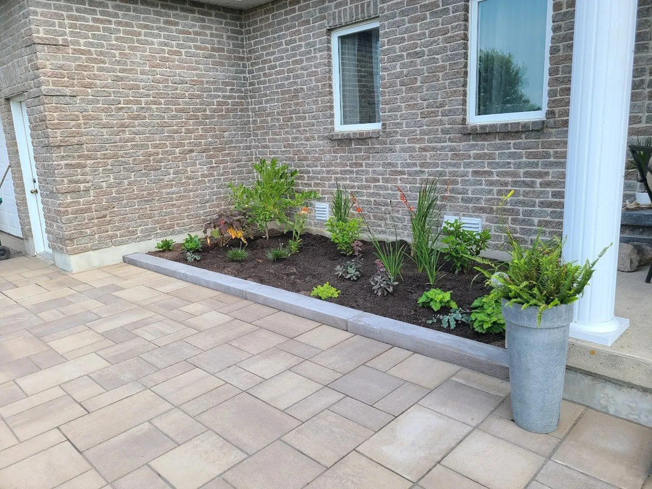 Foundation bed and paver patio in Kanata by ALM Construction