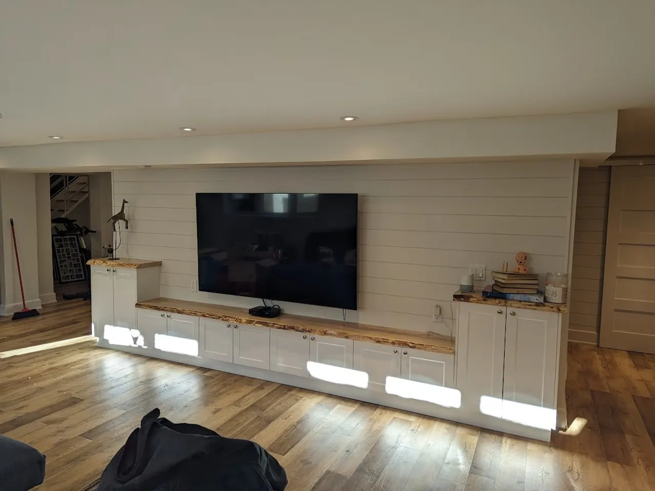 Finished basement with live-edge built-ins in Carleton Place by ALM Construction