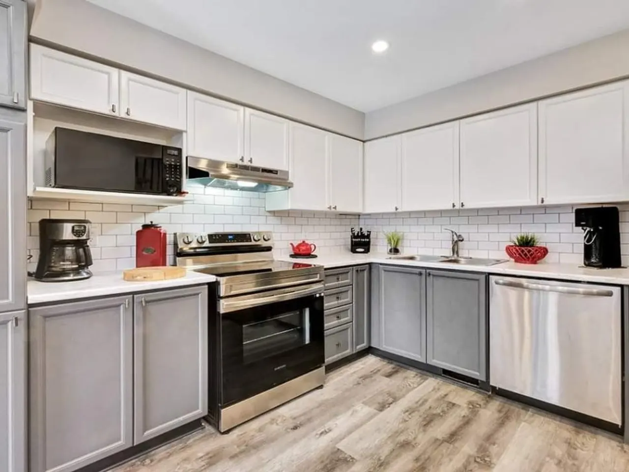Premium custom kitchen renovation with marble waterfall island by ALM Construction